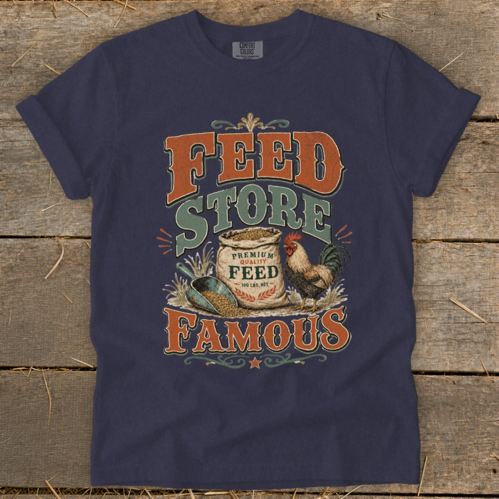 Navy t-shirt with "Famous Feed Store" graphic featuring a rooster and bag of feed.