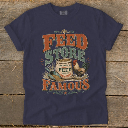 Navy t-shirt with "Famous Feed Store" graphic featuring a rooster and bag of feed.