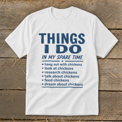 White t-shirt with blue text listing activities done with chickens in spare time.