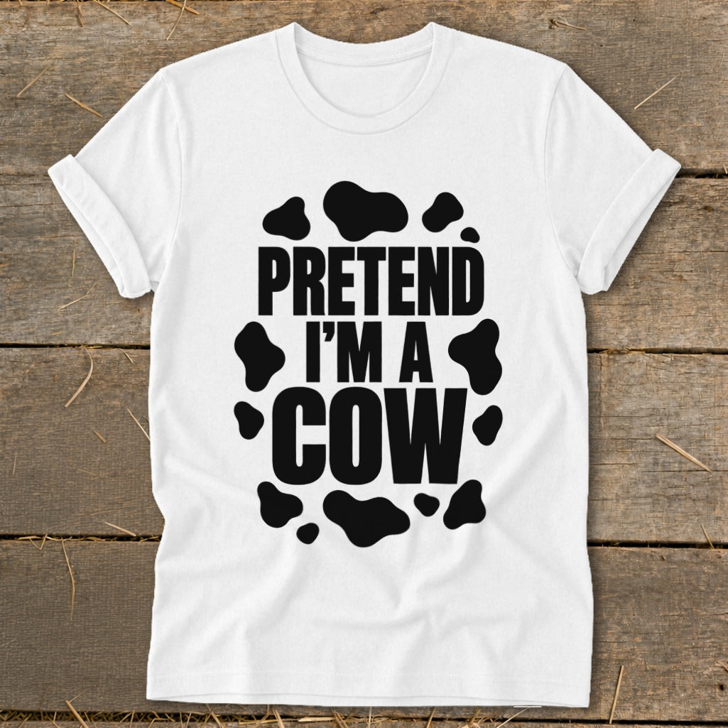 White t-shirt with black text and cow spots that reads "PRETEND I'M A COW".