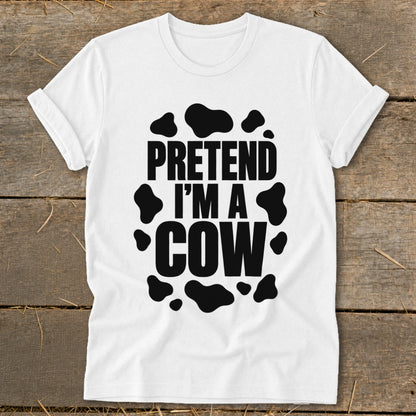 White t-shirt with black text and cow spots that reads "PRETEND I'M A COW".