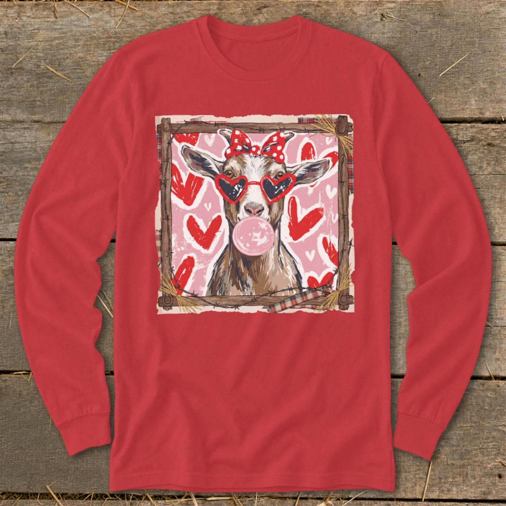 Goat wearing heart sunglasses and polka dot bow blows bubblegum, surrounded by hearts.