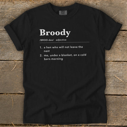 Black t-shirt with "Broody" definition: a hen not leaving the nest or me under a blanket.