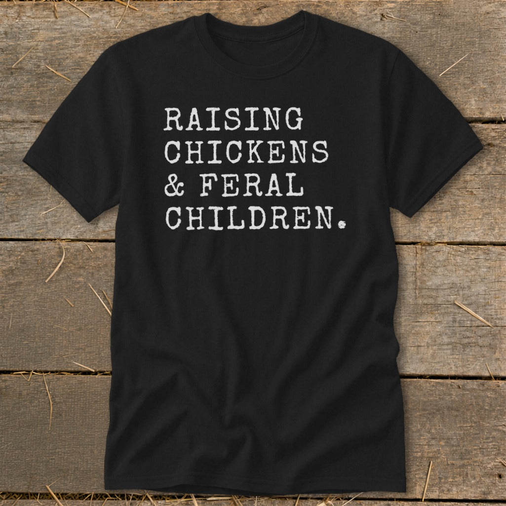 Black t-shirt with white text reading "RAISING CHICKENS & FERAL CHILDREN."