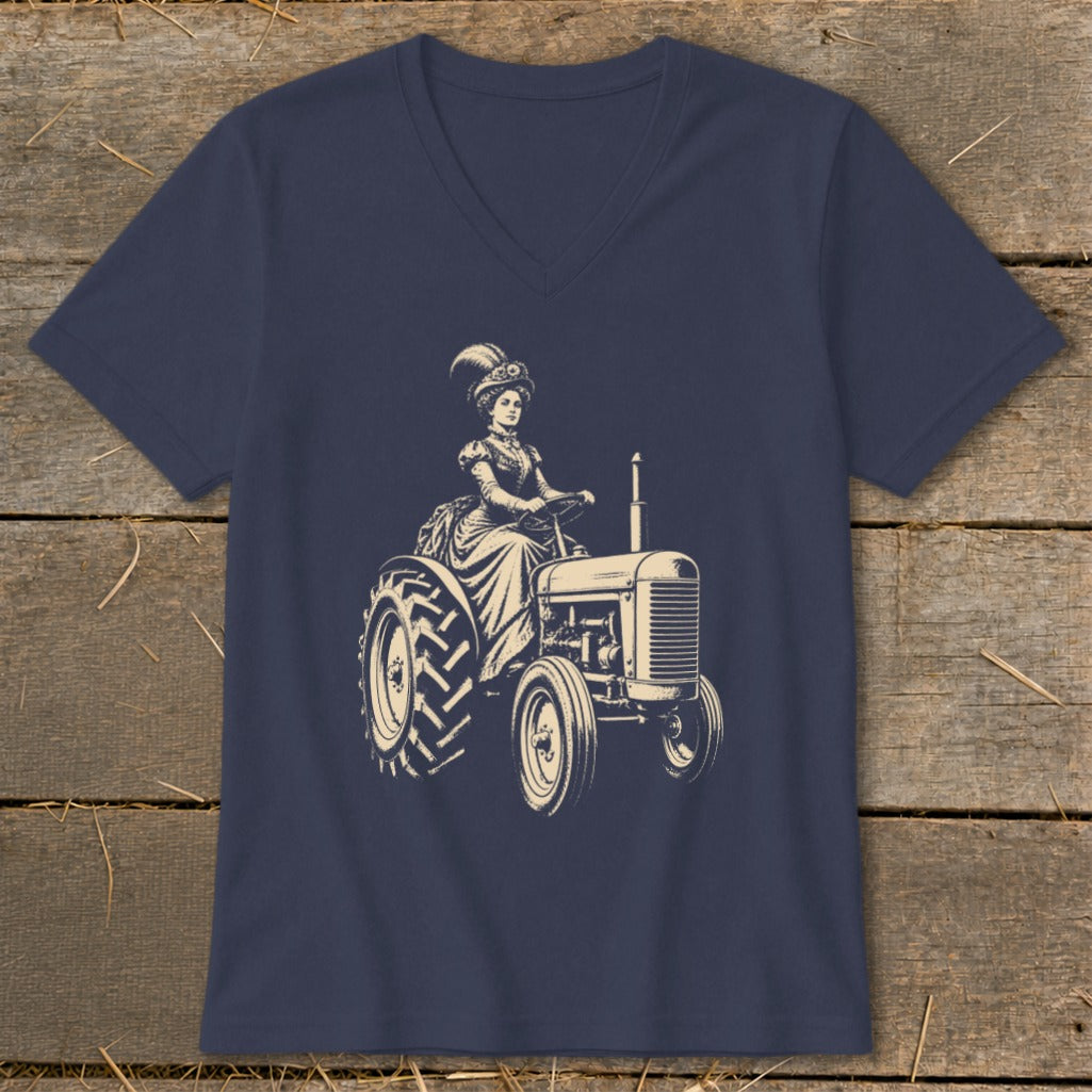 Vintage woman in formal dress and hat driving a tractor.