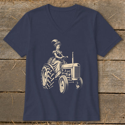 Vintage woman in formal dress and hat driving a tractor.