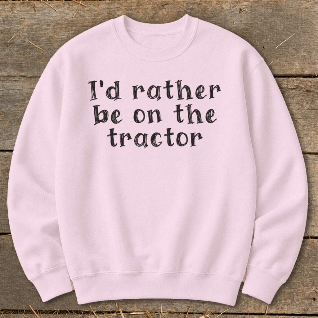 Pink sweatshirt with black text "I'd rather be on the tractor".