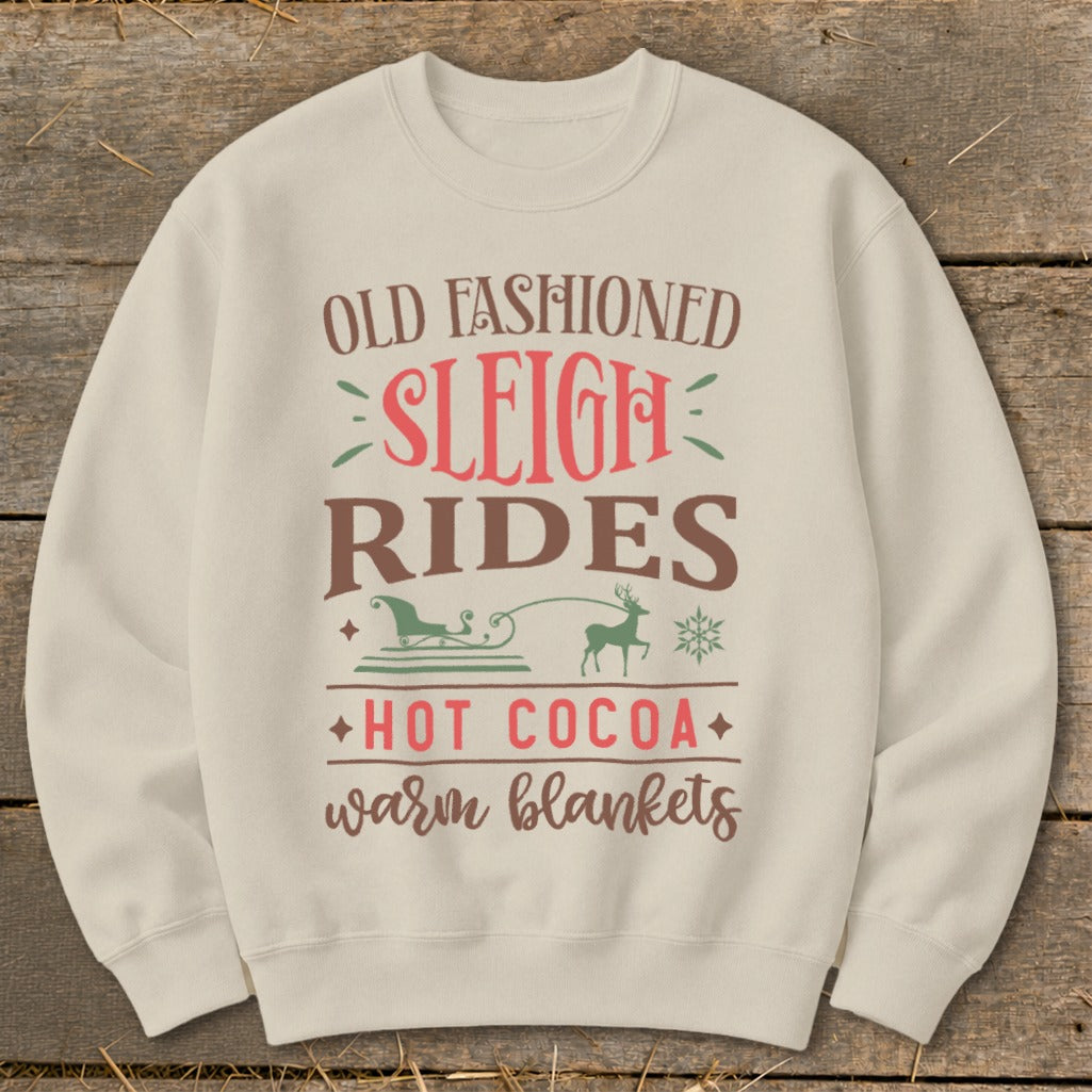 Cream sweatshirt with "Old Fashioned Sleigh Rides" text and winter graphics.