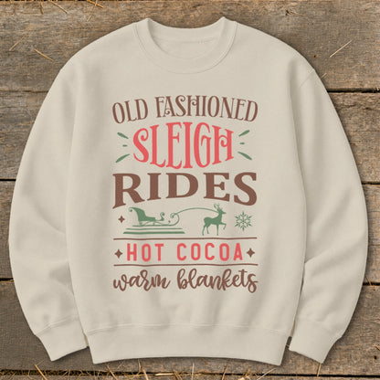 Cream sweatshirt with "Old Fashioned Sleigh Rides" text and winter graphics.