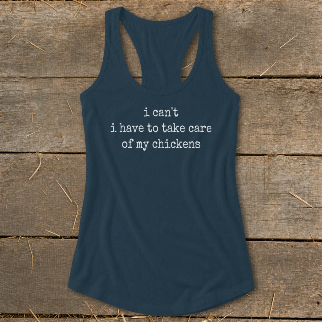 Navy tank top with white text that reads "i can't i have to take care of my chickens".