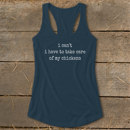 Navy tank top with white text that reads "i can't i have to take care of my chickens".