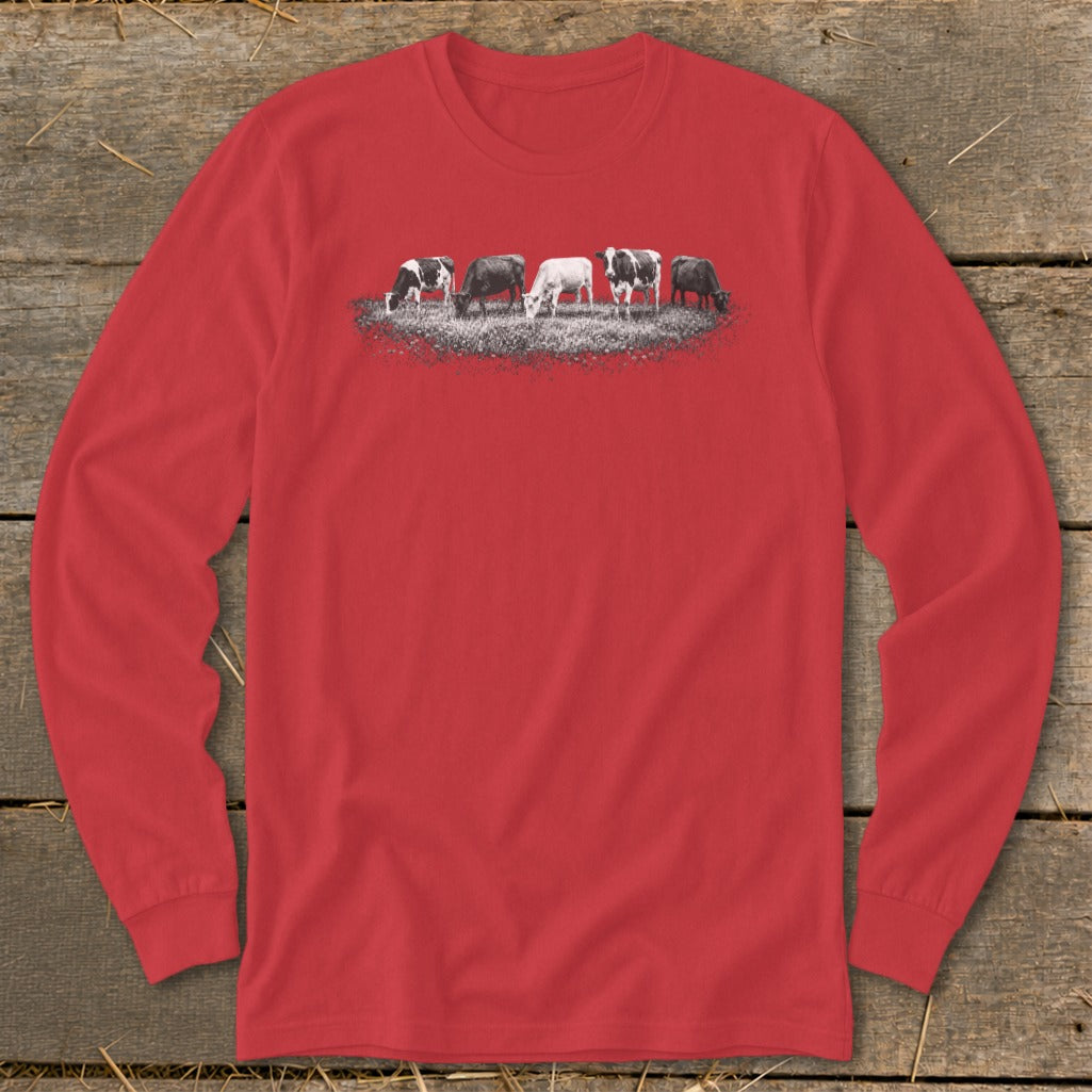 Red long-sleeve shirt with a row of five cows grazing on a field.