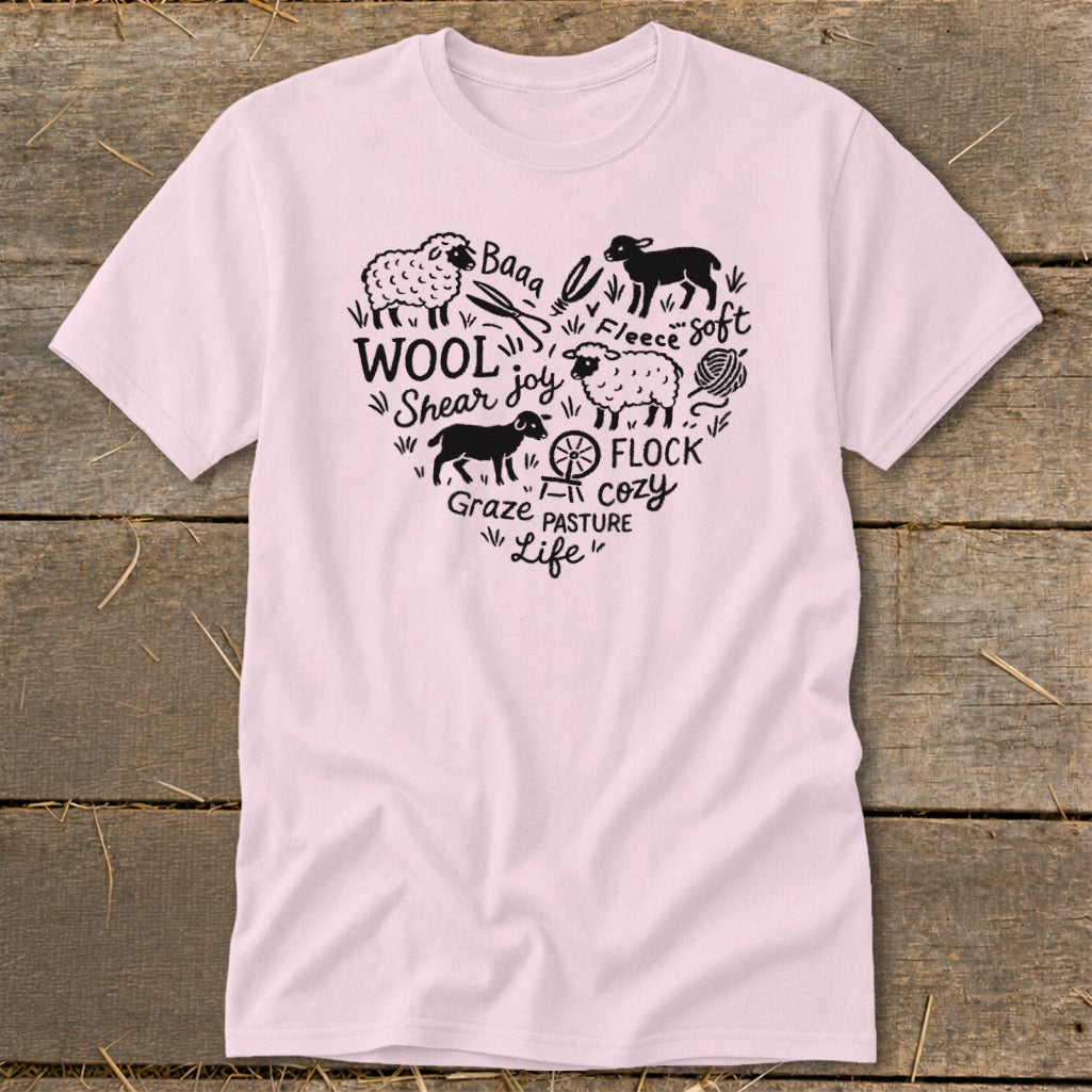 Pink t-shirt with heart-shaped graphic of sheep and farm-related text.