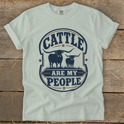 White t-shirt with circular graphic featuring two cattle silhouettes and text "Cattle Are My People."