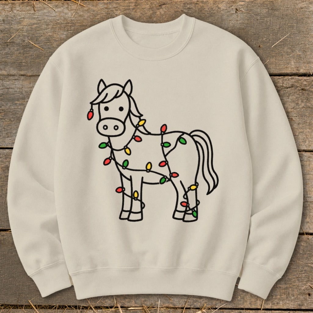 Cream sweatshirt with a black outline drawing of a horse wrapped in colorful Christmas lights.