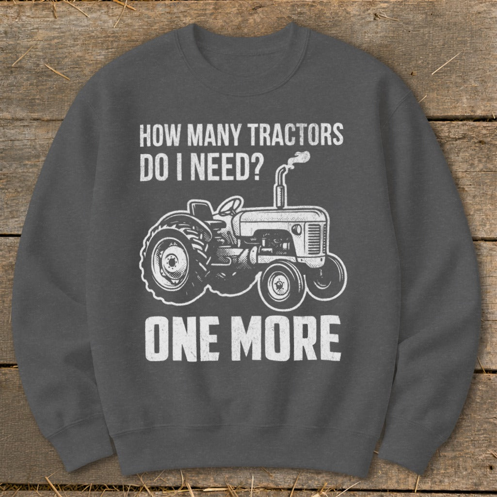 Graphic sweatshirt with tractor and text "How Many Tractors Do I Need? One More".