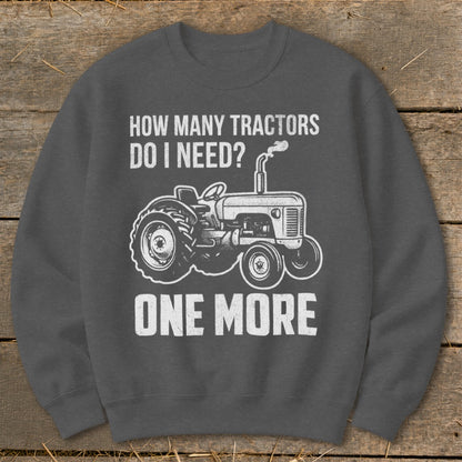 Graphic sweatshirt with tractor and text "How Many Tractors Do I Need? One More".