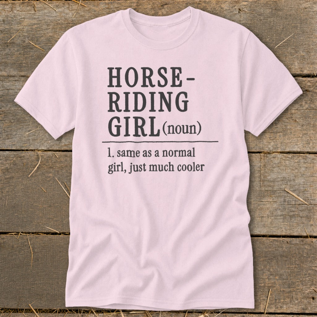 Pink t-shirt with text: HORSE-RIDING GIRL (noun), 1. same as a normal girl, just much cooler.