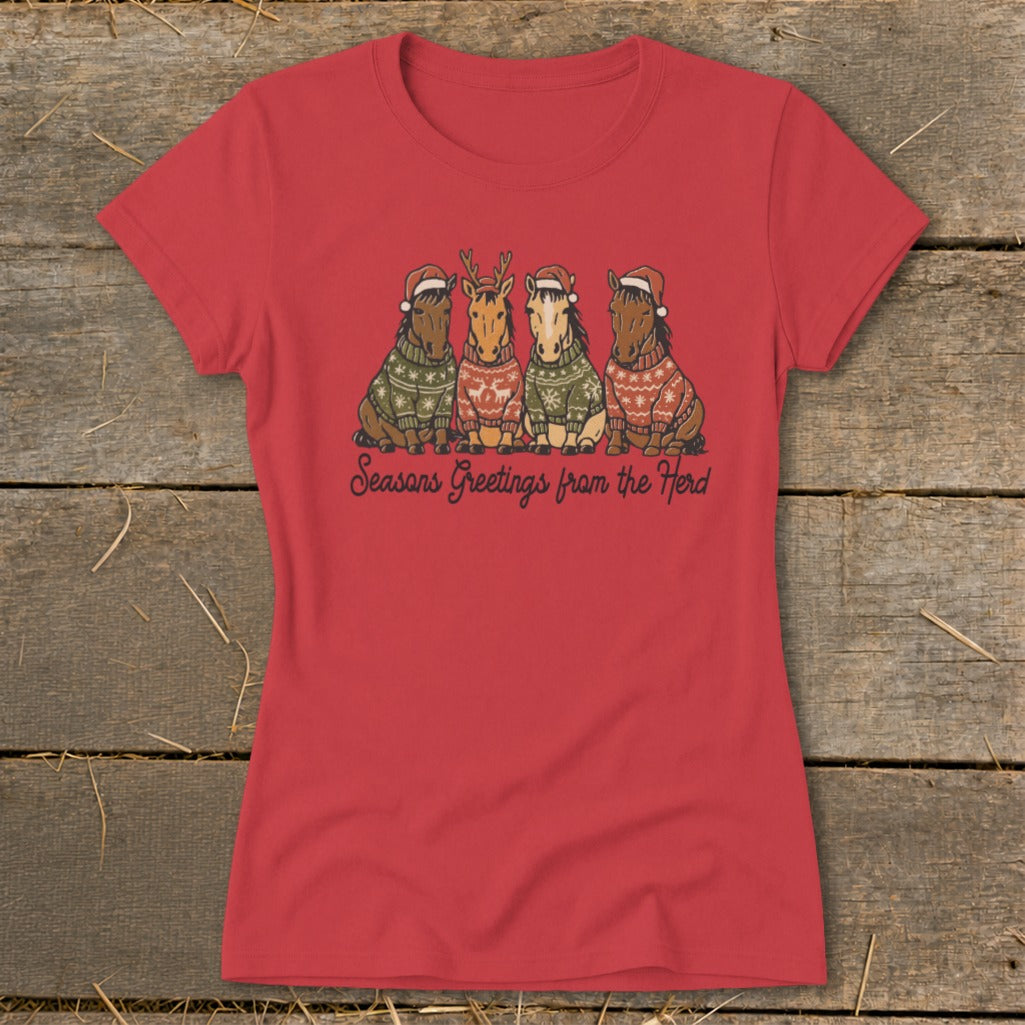 Red t-shirt with four horses in Santa hats and sweaters, reading "Seasons Greetings from the Herd".
