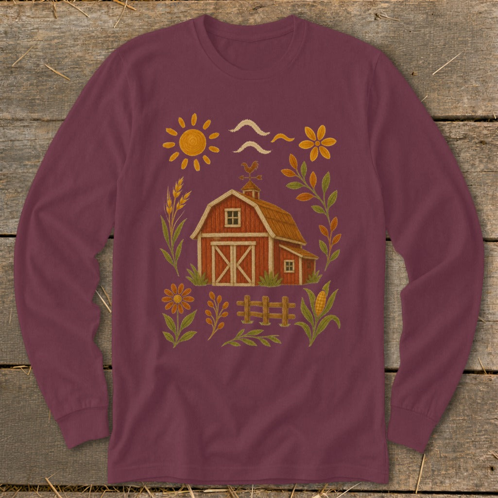 Maroon long sleeve shirt with a barn, sun, and floral farm illustration.