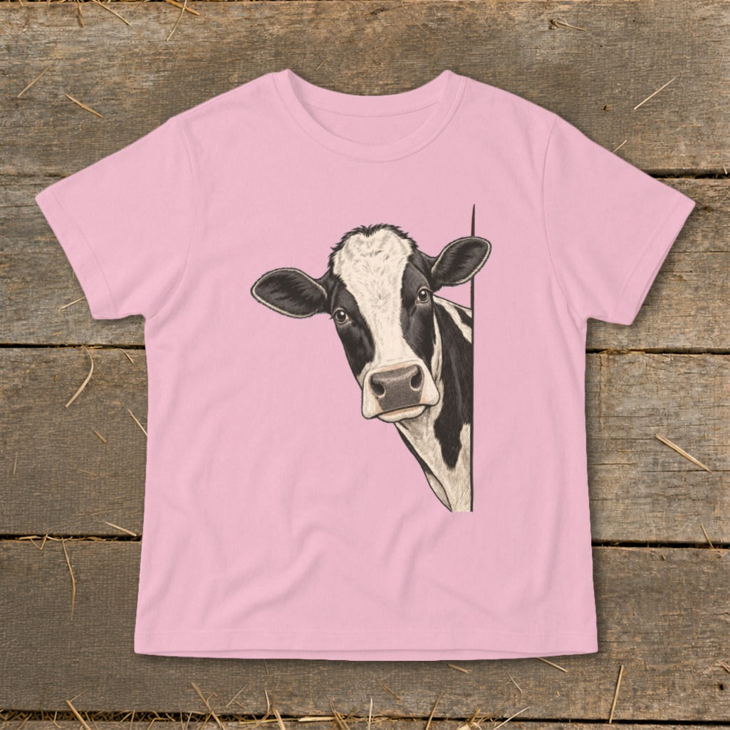 Pink t-shirt with a black and white cow peeking from the side.
