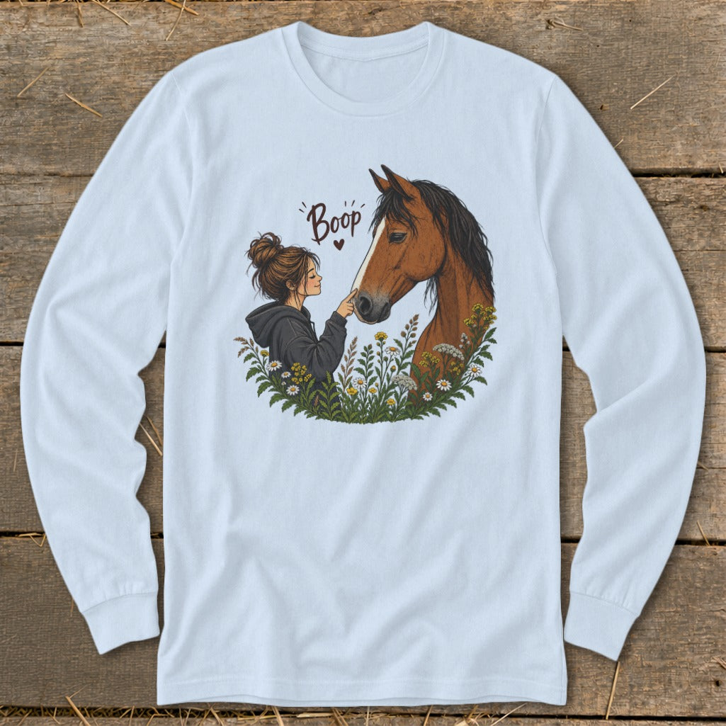 Illustration of a girl booping a horse's nose surrounded by flowers with text "Boop."