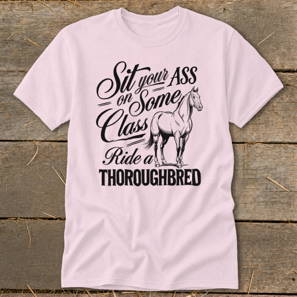 Pink t-shirt with text "Sit your ASS on Some Class Ride a THOROUGHBRED" and a horse.