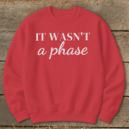 Red crewneck sweatshirt with white text "IT WASN'T a phase".