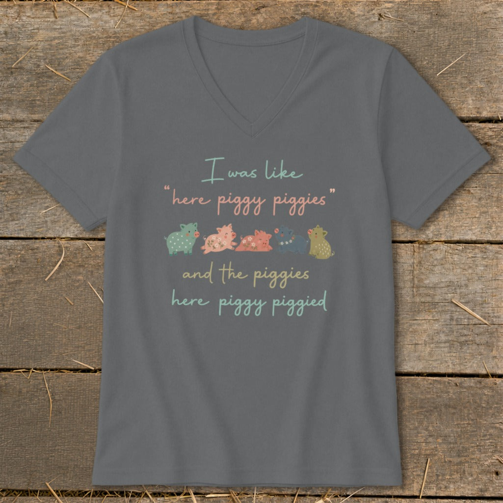 Gray v-neck t-shirt with text and cartoon pigs: "I was like "here piggy piggies" and the piggies here piggy piggied."