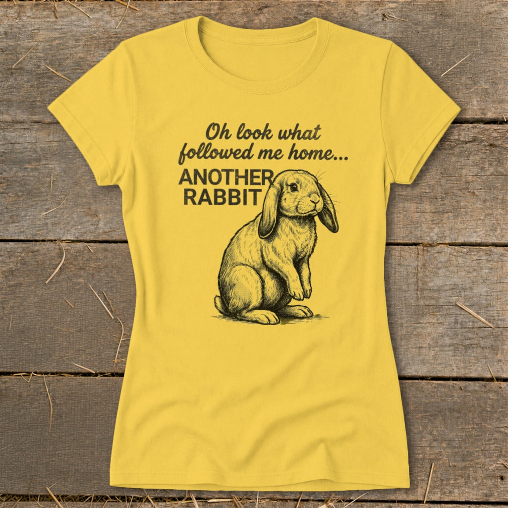 Yellow t-shirt with drawing of a lop-eared rabbit and text "Oh look what followed me home... ANOTHER RABBIT".