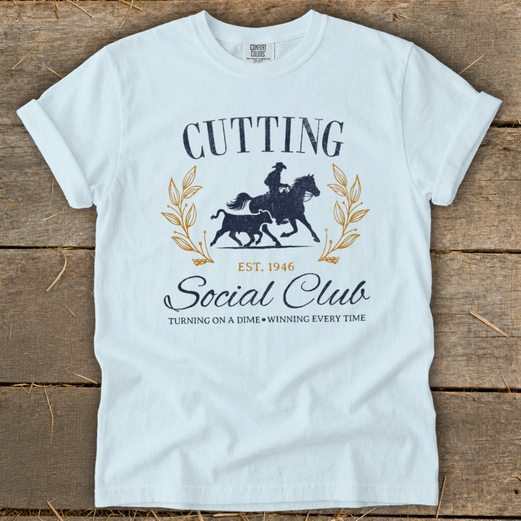 Light blue t-shirt with "Cutting Social Club Est. 1946" graphic.