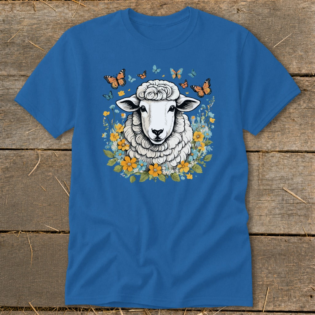 Blue t-shirt with a sheep illustration surrounded by flowers and butterflies.
