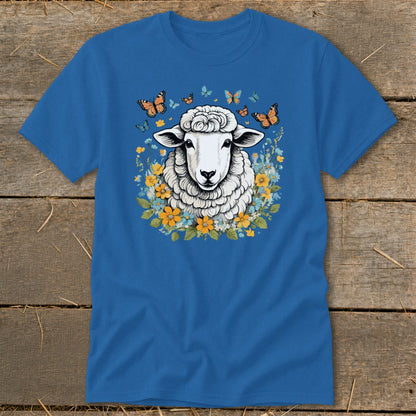 Blue t-shirt with a sheep illustration surrounded by flowers and butterflies.