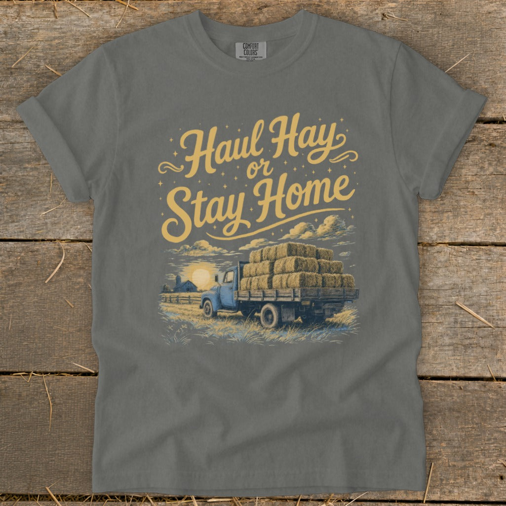 Gray t-shirt with yellow text "Haul Hay or Stay Home" and truck carrying hay bales.