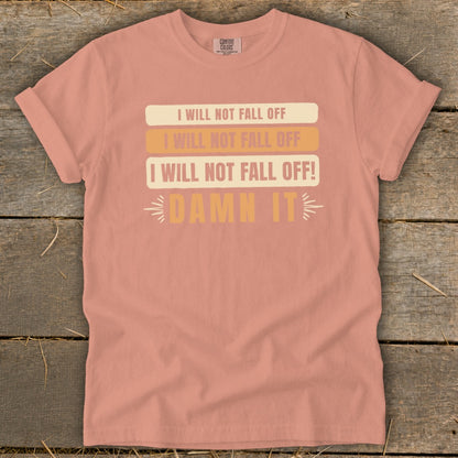 Peach t-shirt with "I Will Not Fall Off" and "Damn It" text.