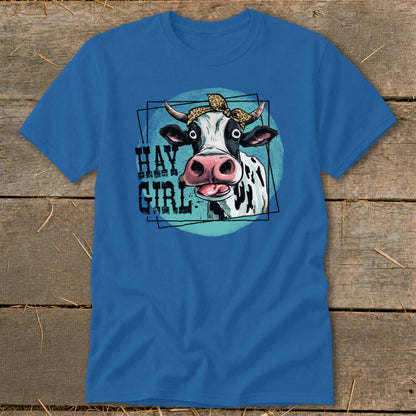 Blue t-shirt with cartoon cow wearing leopard bandana, text "Hay Girl".