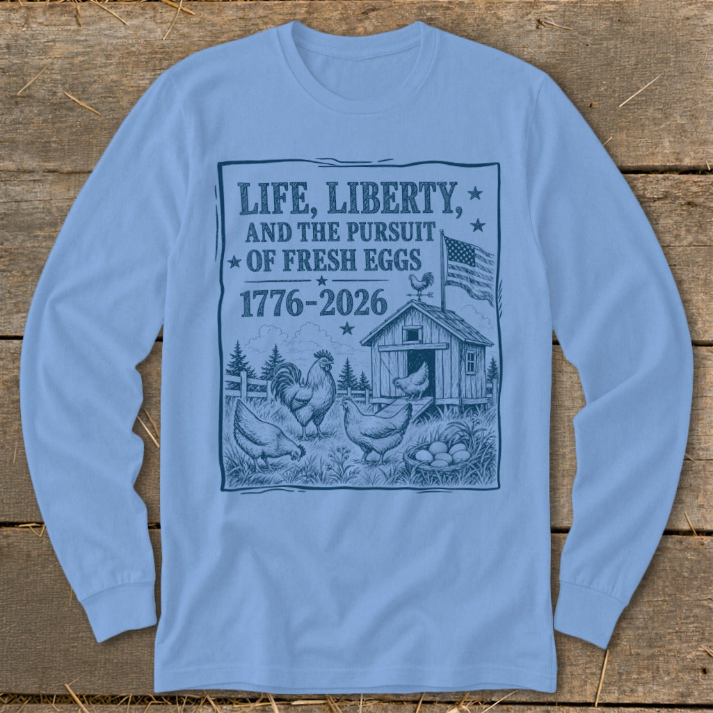 Long-sleeve t-shirt with graphic: "Life, Liberty, and the Pursuit of Fresh Eggs 1776-2026".