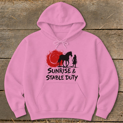 Pink hoodie with black graphic of horse, rider, and red sun with text.