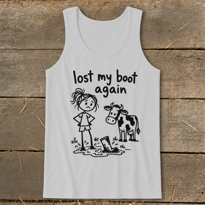 A grey tank top featuring a graphic of a frustrated stick-figure farm girl, a cow, and a boot stuck in mud, with the text "lost my boot again."