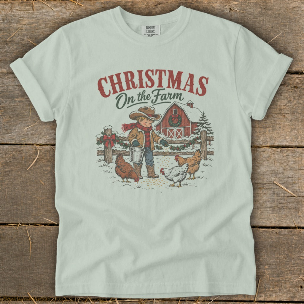 Christmas on the Farm graphic with boy feeding chickens in front of a barn.