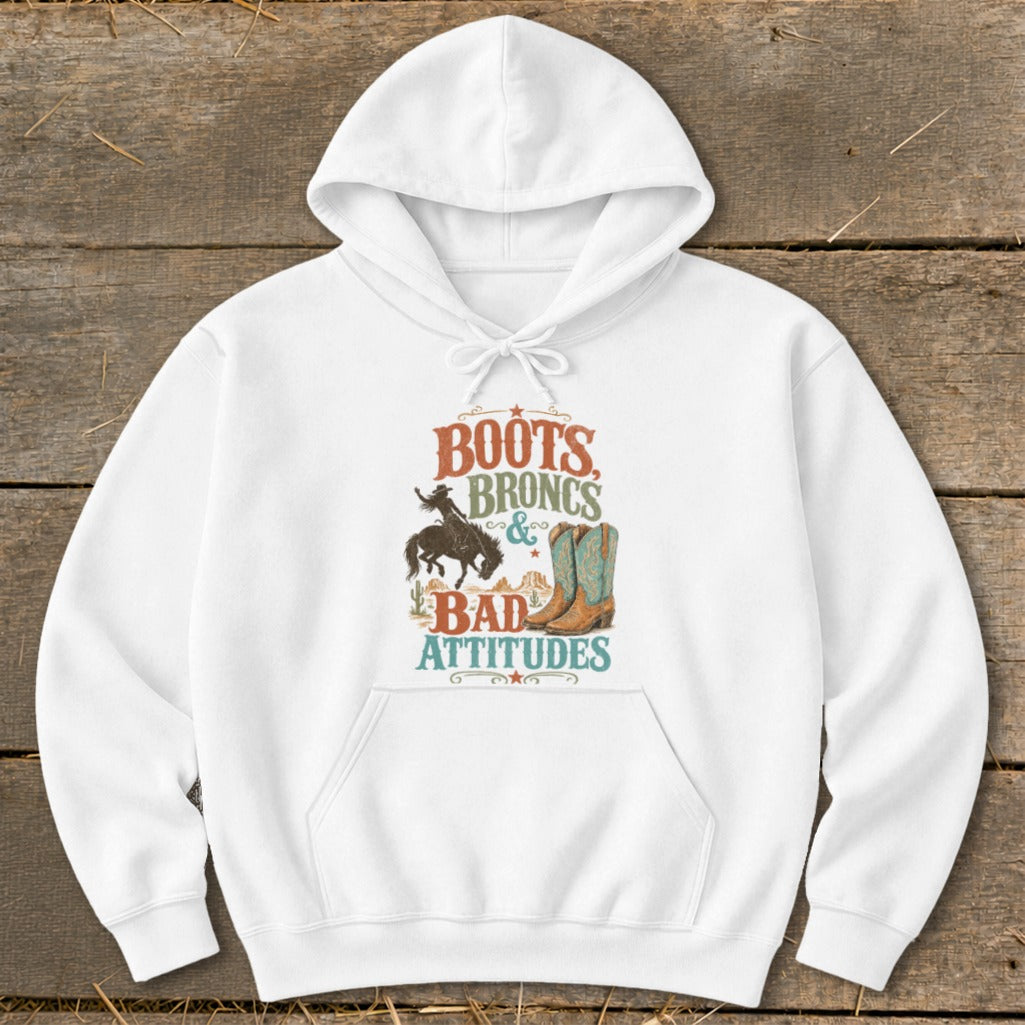 White hoodie with "Boots Broncs & Bad Attitudes" graphic and cowboy imagery.
