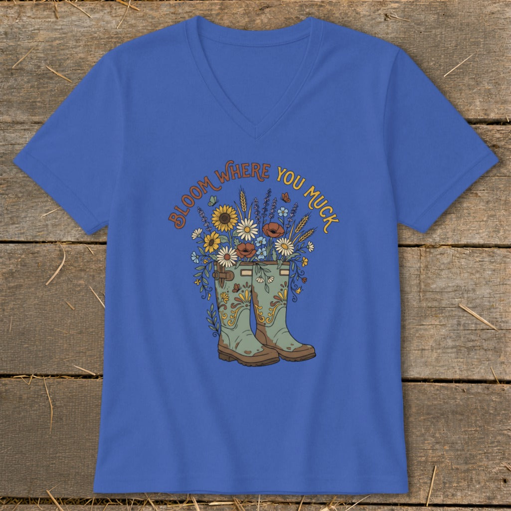 Royal blue t-shirt with a floral illustration and the text "Bloom Where You Muck".