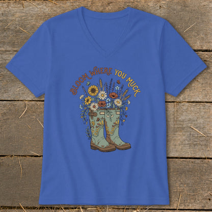Royal blue t-shirt with a floral illustration and the text "Bloom Where You Muck".