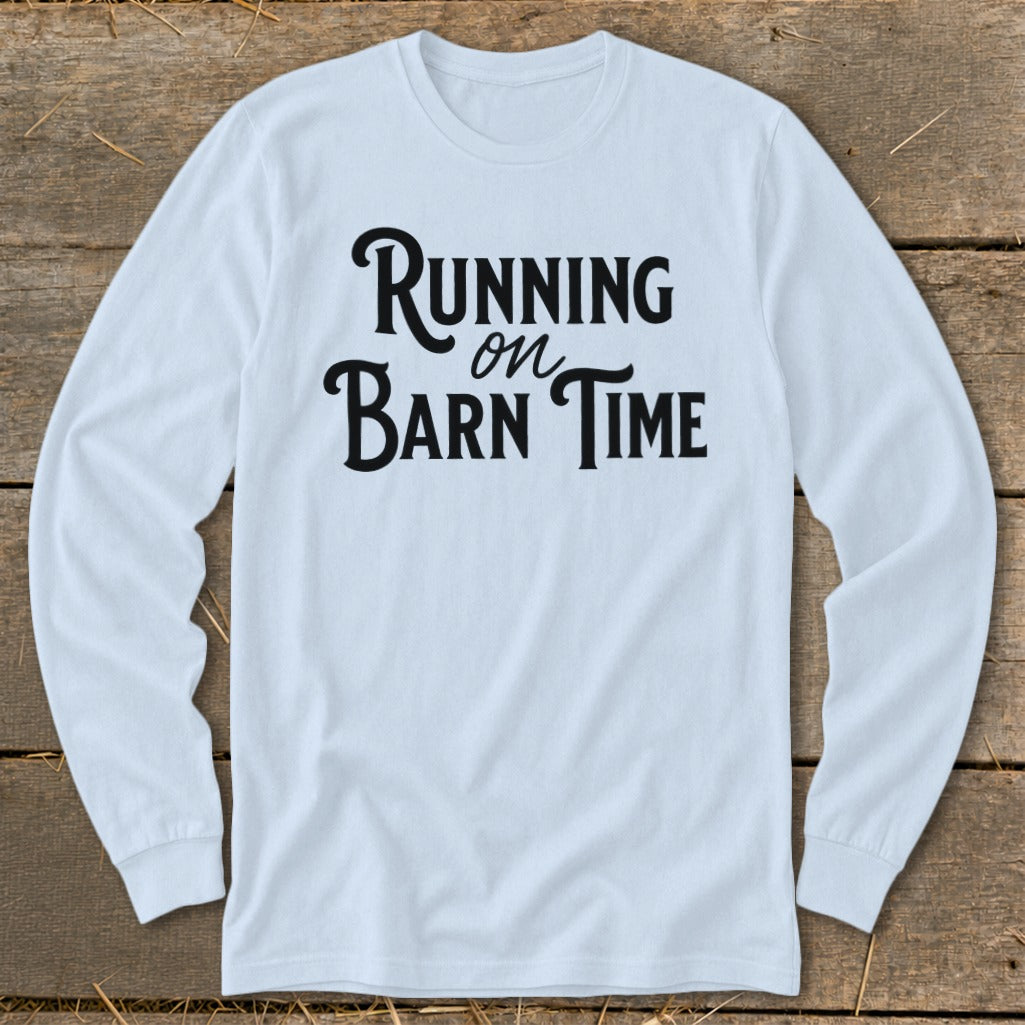 Light blue long sleeve shirt with "Running on Barn Time" text in black.