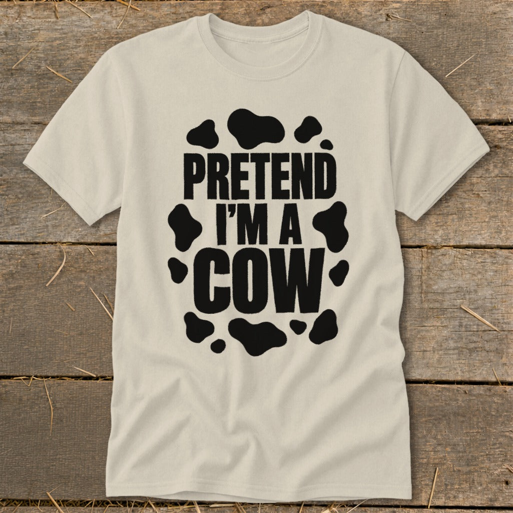 Light-colored t-shirt with black text "PRETEND I'M A COW" and cow spots.