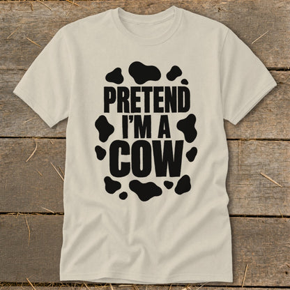Light-colored t-shirt with black text "PRETEND I'M A COW" and cow spots.