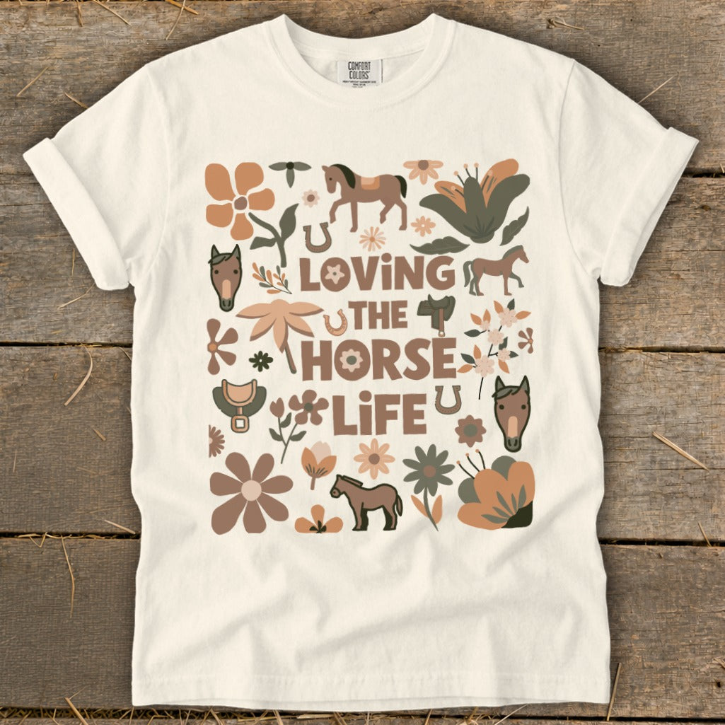 T-shirt with "Loving The Horse Life" text and horse and floral graphics.