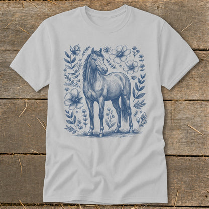 Light grey t-shirt with a blue sketched horse surrounded by floral elements.