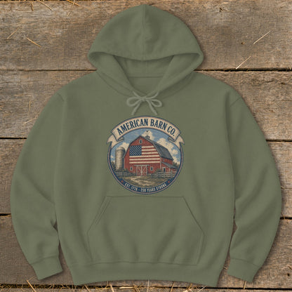Olive green hoodie with American Barn Co. logo featuring a barn and American flag.