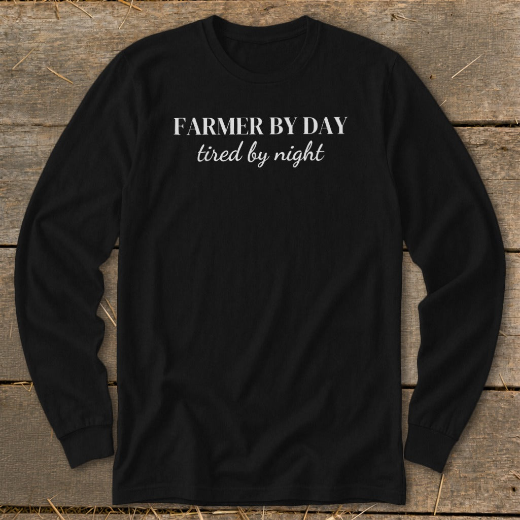 Black long sleeve shirt with white text "FARMER BY DAY tired by night".